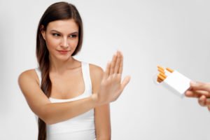 Beautiful Woman Refusing To Take Cigarette From Pack
